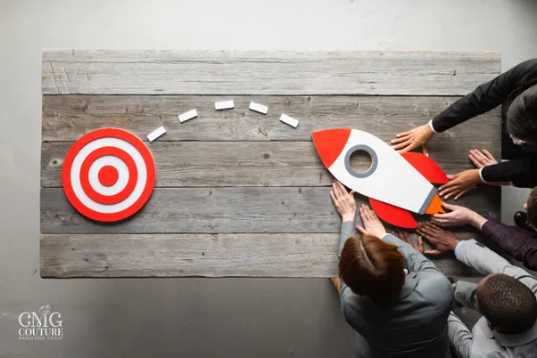 7 Key Components of Web Development & the Roadmap to Online Success 8 Individuals united in a circle around a target with a rocket, illustrating collective effort towards web development success